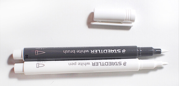 white pen and brush